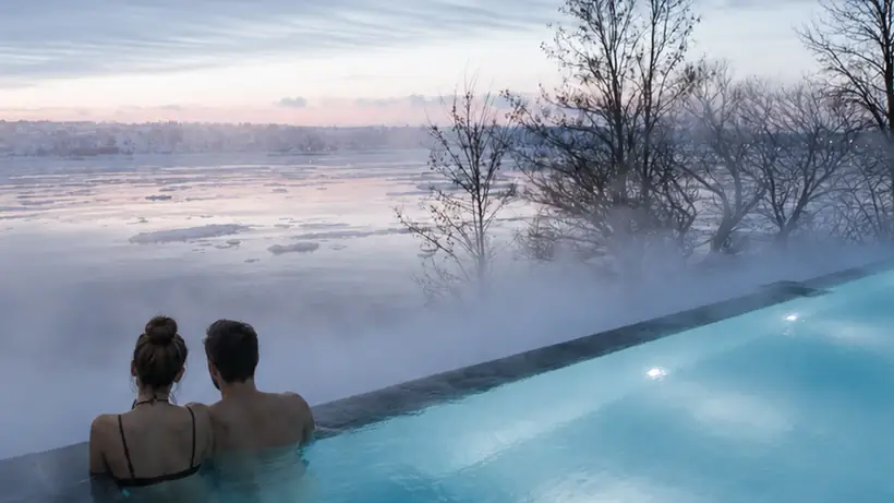 Nordic bath overlooking the St. Lawrence River in winter
