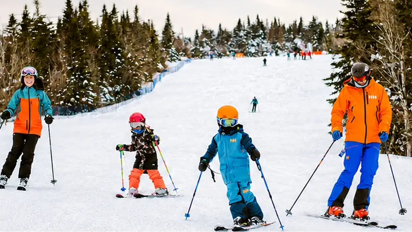 A family downhill skiing