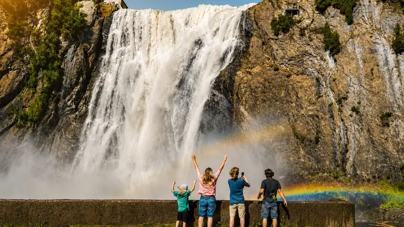 A family in front of Montmorency Falls