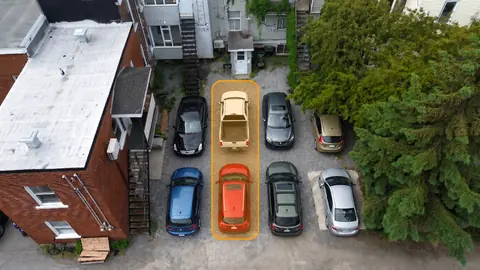 Aerial view of parking with highlighted spaces